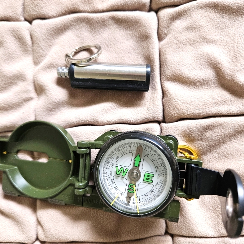 Nifty travel compass & flint match